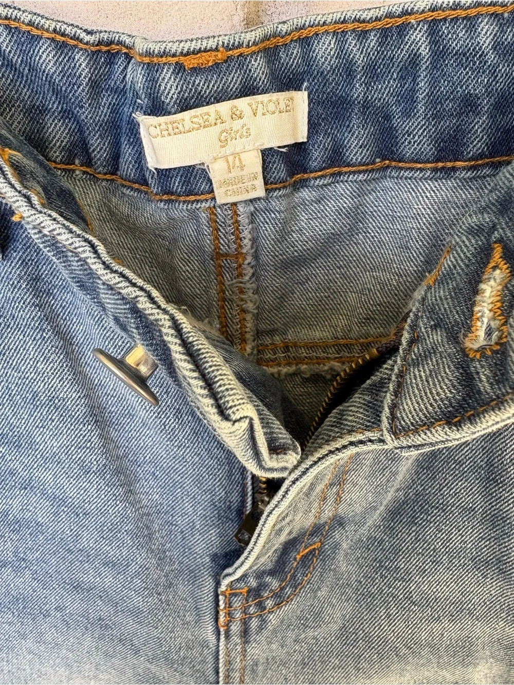 Chelsea & Violet Distressed Blue Denim girls Shorts.  fringe hem